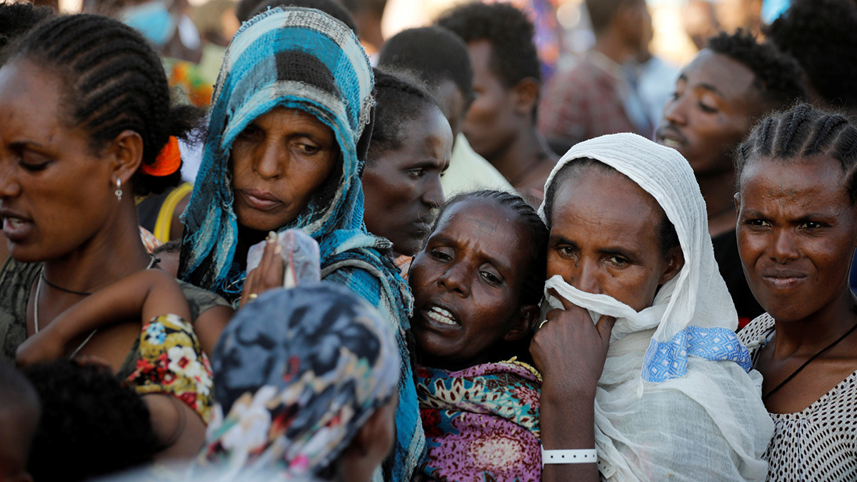 Ethiopian refugees stand in for supplies at the Um Rakuba refugee camp which houses refugees fleeing the fighting in the Tigray region, on the Sudan-Ethiopia border in Sudan, November 29, 2020. REUTERS/Baz Ratner - RC2ADK93HUQB